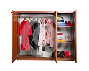 Modern wooden wardrobe with clothes and shoes