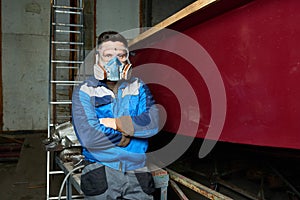 Modern Worker in Boat Workshop