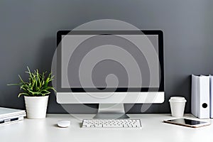 Modern Workspace Setup: Sleek Desktop Computer, Keyboard, Mouse, and Tablet on a Minimalist White Desk