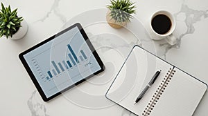 Modern Workspace Setup with Tablet Displaying Bar Chart Data Analysis and Coffee Cup