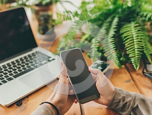 Modern Workstation with Smartphone and Laptop