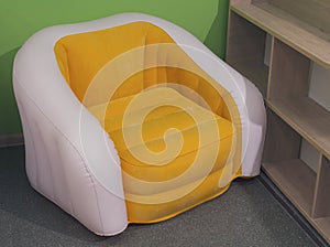 Modern yellow chair in minimalist interior