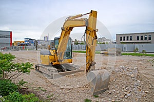 Modern Yellow Excavator at Construction Site. Horizontal image of bulldozer