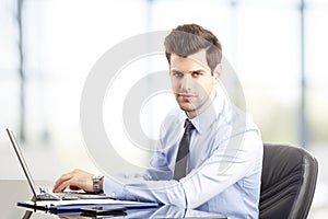 Modern young businessman at office