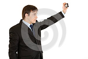 Modern young businessman photographing himself