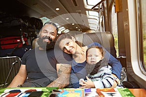 Modern young family in train