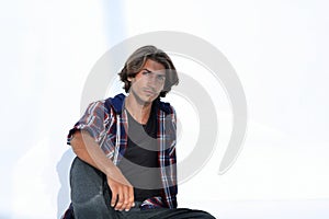 Modern young man thinks.isolated on white.