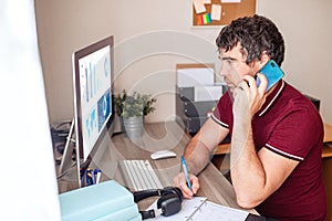 A modern young person works remotely from home. Young man video conference via computer. Home office. Stay at home and