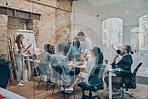 Modern young woman conducting a business presentation