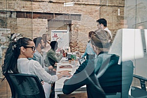 Modern young woman conducting a business presentation