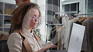 modern young woman uses modern technologies and sells goods in an online store, arranging dispatches for a customer