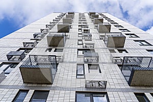 Moderne multy-storey apartment facade of residential building. The view from the top down.