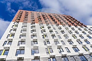 Moderne multy-storey apartment facade of residential building. The view from the top down.