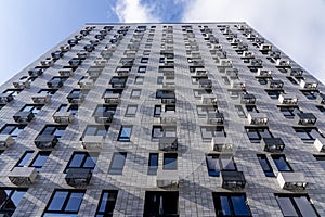 Moderne multy-storey apartment facade of residential building. The view from the top down.