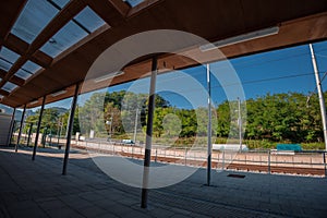 Modernised train station of Rimske toplice, close to Lasko, Slovenia on a summer day. Visible platform and shade next to the