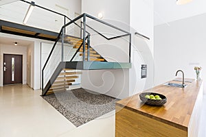 Modernistic interior with massive staircase photo