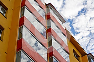 Modernized block of flats with aluminium balconies in Ostrava, Czech Republic, sky reflection