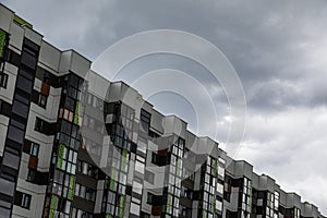 Modernly designed multiple dwelling against gloomy sky