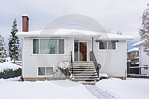 Modest North American house on winter cloudy day