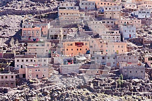 Modest traditional berber village with cubic houses in Atlas mountains, Morocco