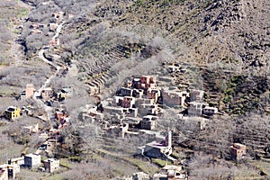 Modest traditional berber village with cubic houses in Atlas mountains, Morocco