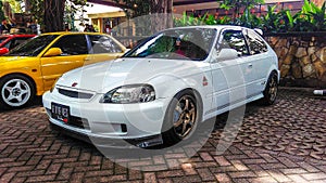 Modified Honda Civic Type R EK9 hatchback in a car meet