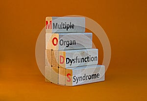 MODS multiple organ dysfunction syndrome symbol. Concept words MODS multiple organ dysfunction syndrome on blocks on a orange