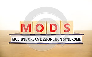 MODS multiple organ dysfunction syndrome symbol. Concept words MODS multiple organ dysfunction syndrome on cubes on a white