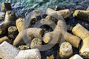 Modular concrete blocks Riprap, also known as rip rap, rip-rap, shot rock, rock armor, or rubble used to armor shoreline photo