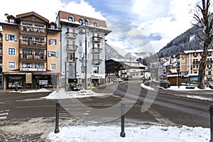 Moena, Trentino, Alps, Dolomiti, Italy-4 February, 2018: Street of the city of Moena. Winter city in the mountains. Snow-capped ci