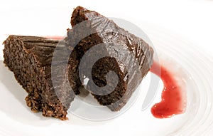 Moist chocolate cake with cherry sauce photo