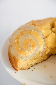 Moist and delicious homemade pineapple cake. Slice of cake placed on a plate, ready to eat.
