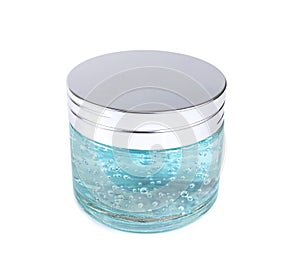 Moisturizer and blue cosmetic gel in a glass jar