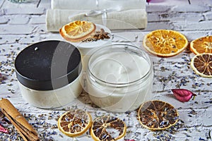 Moisturizing cream organic with a lavender and orange dry on a brick table