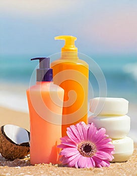 Moisturizing oils and lotions for tanning on a beach against the sea