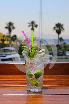 mojito cocktail on the beach. Close-up mojito cocktail at the bar. Mojito cocktail with mint and lime.