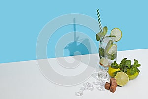 Mojito cocktail on double white blue background with shadow. Copy space