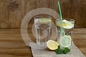 Mojito cocktail with lime.summer drinks. close-up glass of lemonade with lemon and fresh leafs mint