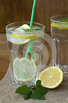 Mojito cocktail with lime.summer drinks. close-up glass of lemonade with lemon and fresh leafs mint