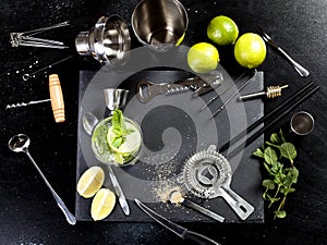 Mojito cocktail making. Ingredients and utensils.