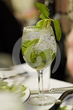 Mojito Cubano or caipirinha cocktail, iced drink with lime and mint photo