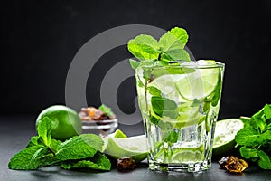 Mojito Cubano or caipirinha cocktail, iced drink with lime and mint photo