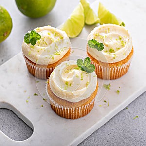 Mojito cupcakes with lime and coconut garnished with mint