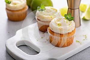 Mojito cupcakes with lime and coconut garnished with mint