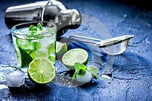 Mojito in glass on dark background close up