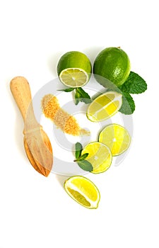 Mojito ingredients. Lime, mint and cane sugar isolated on white background