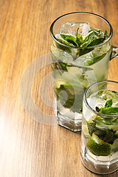 Mojito on rustic wooden background. Frutal alcoholic cocktails. Cuban drinks concept with space for text