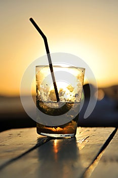 Mojito at sunset in a beach bar photo