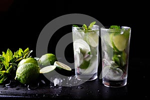 Mojito traditional summer vacation refreshing cocktail alcohol drink in glass, bar preparation soda water beverage, lime