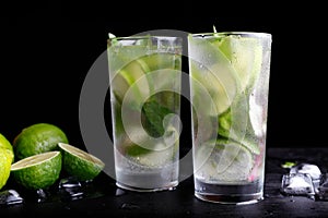 Mojito traditional summer vacation refreshing cocktail alcohol drink in highball glass